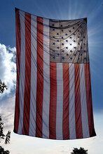 Sun Behind American Flag Hanging