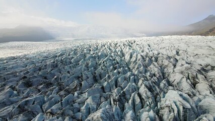 Wall Mural - Aerial glacier texture of crevasses. Vatnajokull glacier in Iceland. High quality 4k footage