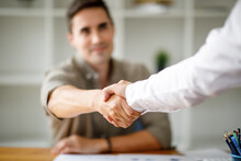 Business Man Offer And Give Hand For Handshake In Office. Successful Job Interview. Apply For Loan In Bank. Salesman, Bank Worker Or Lawyer Shake For Deal, Agreement Or Sale. Increase Of Salary.
