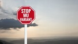 Fototapeta Las - Traffic sign: ‘STOP MU VARIANT’ on cement pole beside the rural road with sunset and landscape background, copy space, concept for calling drivers and passengers to stop new variant coronavirus now.