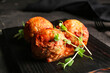 © Pixel-Shot - Wooden board with delicious meatballs on dark background