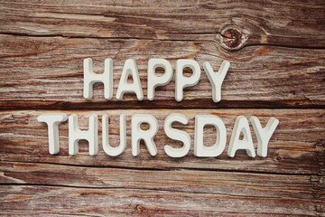 Wall Mural - happy thursday text message on wooden background