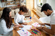 © NDABCREATIVITY - Happy multiethnic family spending time together at home. Parent child education fun concept