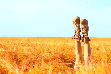 Wall Mural - happy young adult model in yellow wheat field / summer happiness concept girl in the field