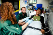© Rawpixel.com - Paramedics providing first aid to a patient