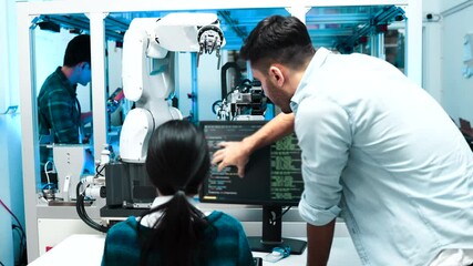Wall Mural - Meeting asian Engineers Maintenance Robot Arm at Lab. they are in a High Tech Research Laboratory with Modern Equipment. Technology and Innovation Concept.Professional Japanese Development Engineer.