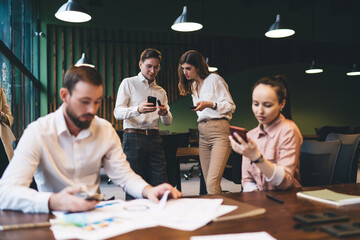 Sticker - Workers discussing business project in office