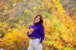 © Olesya Pogosskaya - a young woman in an autumn park in a purple sweater