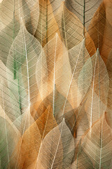 Background from artificial autumn leaves, closeup