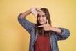 © Odua Images - attractive woman smiling with gesture making frame for her head with both fingers with copyspace