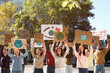 © New Africa - Group of people with posters protesting against climate change on city street