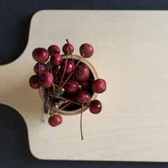 Wall Mural - berries in a wooden container on a board