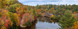 Panoramic view of Dead river landscape  with old 510 bridge crossing surrounded by autumn trees in Michigan upper peninsula