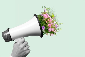 Sticker - Megaphone with bouquet with blooming spring fresh flowers on pastel background.