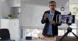 © nimito - Caucasian mature male professor having online class using cellphone camera record
