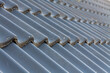 © Mirco Vacca/Wirestock - Selective closeup of gray roof tiles