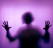© F Armstrong Photo - Sihouette of Woman touching highly diffused purple frosted glass