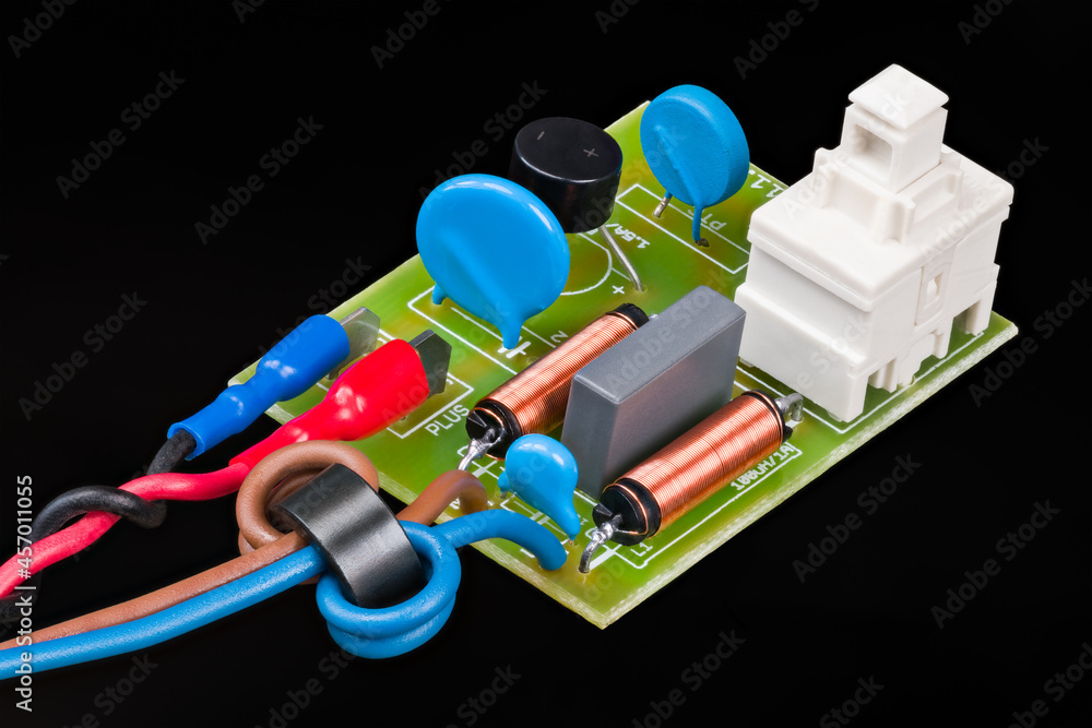 Electronic components of electric motor supply module on black ...