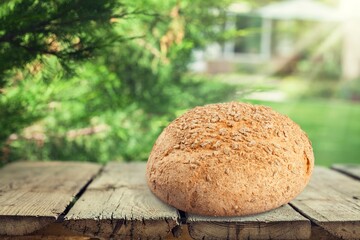 Crispy fresh baked bread roll bun on the desk