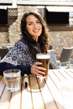 Woman Enjoying A Drink Outside Restaurant