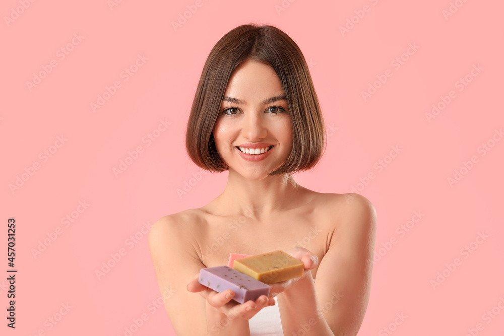 Beautiful young woman with soap on color background