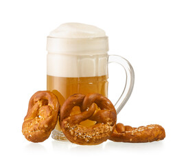 Mug of fresh beer and pretzels on white background. Oktoberfest celebration