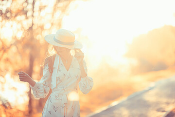 Wall Mural - girl in a straw hat portrait spring freedom / concept spring view model happy people