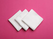 Stylish white handkerchiefs on pink background, flat lay