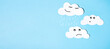 © Алекс Ренко - Paper silhouettes of clouds with different emotions on a blue background. Flat lay, place for text. Psychotherapy and psychology concept.
