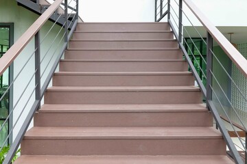 Wall Mural - light brown wooden stairs leading up to the building