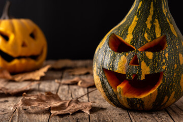 Halloween green pumpkins on rustic wooden table. Copy space