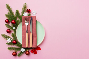 Sticker - Christmas table place setting with christmas decor and plates, kine, fork and spoon. Christmas holiday background. Top view with copy space