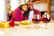 © yurakrasil - african american couple celebrate 14 february valentines day in living room