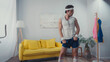 © LIGHTFIELD STUDIOS - funny sportsman exercising with dumbbells in living room, retro sport concept