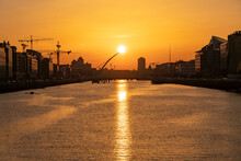 DUBLIN, IRELAND - 12 SEPTEMBER 2021: Sunset At Samuel Beckett Bridge Crossing The River Liffey In Dublin, Ireland