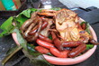 Taiwanese aboriginal food. barbecue chicken and sausage,. In a local village.