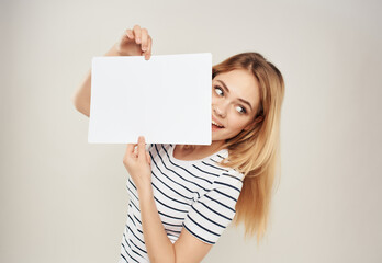 Wall Mural - cheerful blonde in a striped t-shirt white sheet Coffee Space advertising