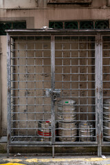 Beer keg barrels stored outside a bar