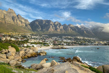 Scenic View Of Camps Bay, South Africa With Twelve Apostles In The Background.