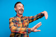 © deagreez - Photo portrait man laughing dancing at party looking blank space isolated vibrant blue color background