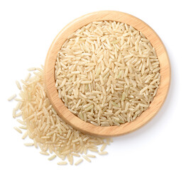 Sticker - raw long brown rice in the wooden plate, isolated on the white background, top view