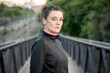 © luisrojasstock - Portrait of caucasian young boxer woman on a bridge at sunset
