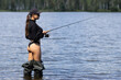 Sexy woman fishing back view