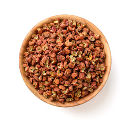 Wall Mural - dried Szechuan peppercorns in the wooden bowl, isolated on the white background, top view