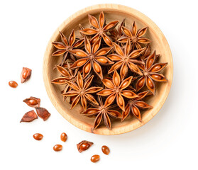 Wall Mural - star anise in the wooden plate, isolated on the white background, top view