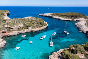 Aerial view, Cala Sa Nau, near Cala d'Or, with beaches and sailing boats, Migjorn region, Mallorca, Balearic Islands, Spain