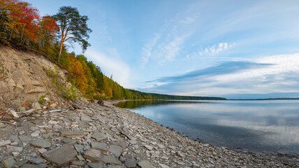 Wall Mural - autumn landscape, rocky river bank, clear water.