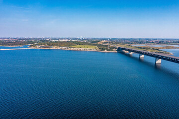 Wall Mural - Panoramic aerial view of the Oresundsbron bridge between Denmark and Sweden. Oresund Bridge view at sunset.