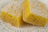 Fototapeta Do przedpokoju - Homemade lemon bars dessert on a white plate on the table