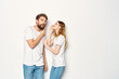 © SHOTPRIME STUDIO - Cheerful man and woman in white t-shirts embrace friendship together